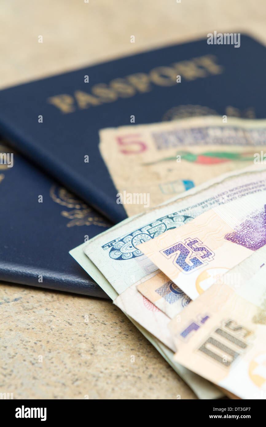 travel documents and different international currencies on a counter