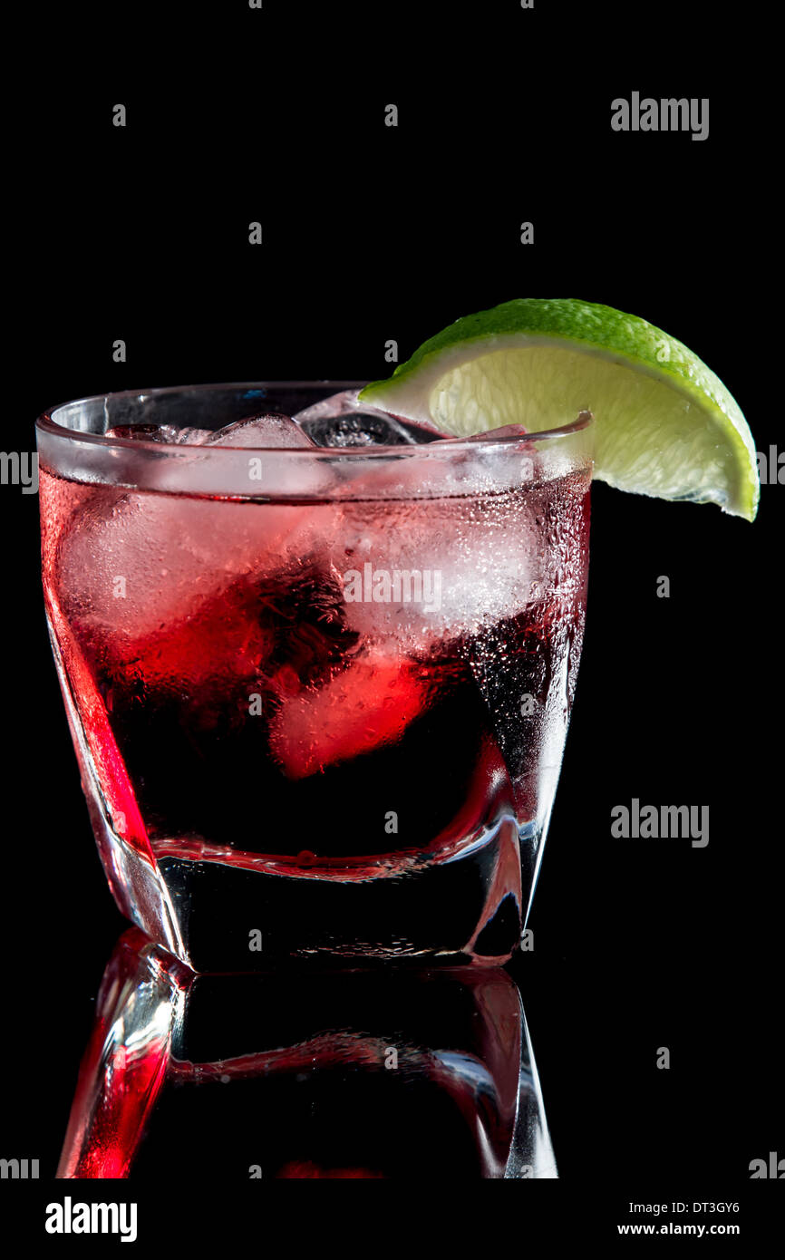 vodka and cranberry served on the rocks isolated on a black Stock Photo