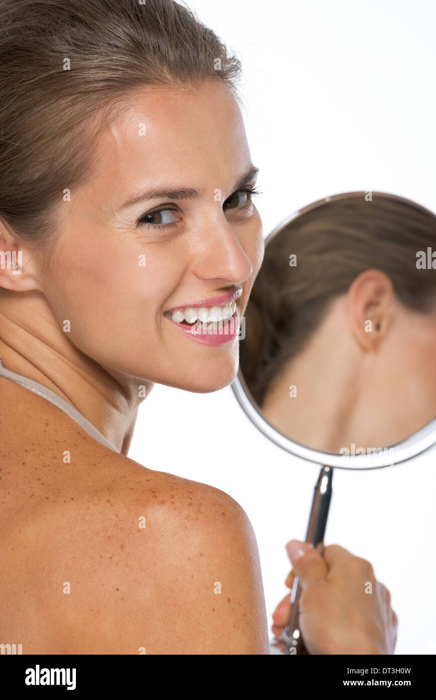 Portrait of smiling young woman with mirror Stock Photo