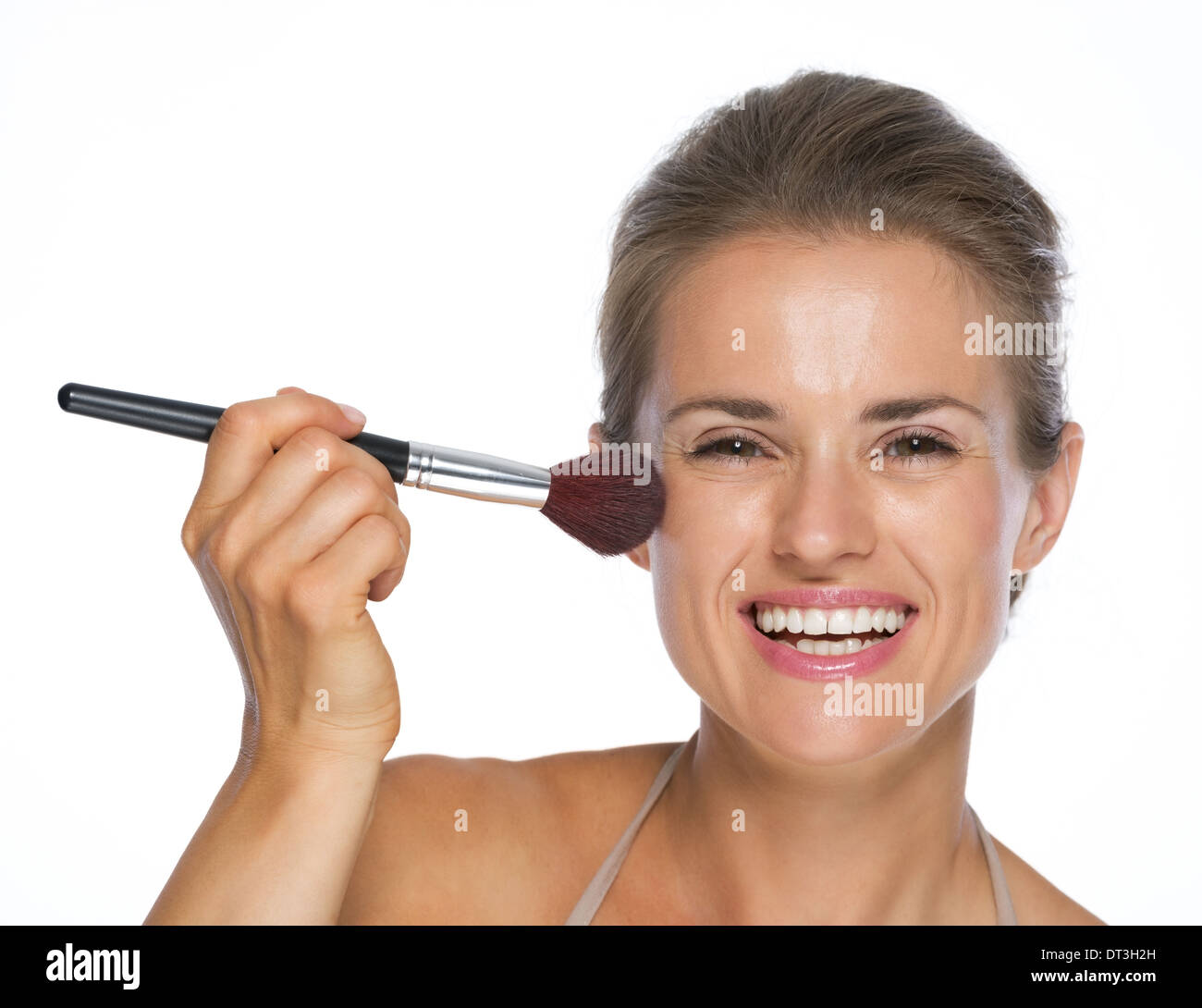 Woman using up brush smiling hi-res stock photography and images - Alamy