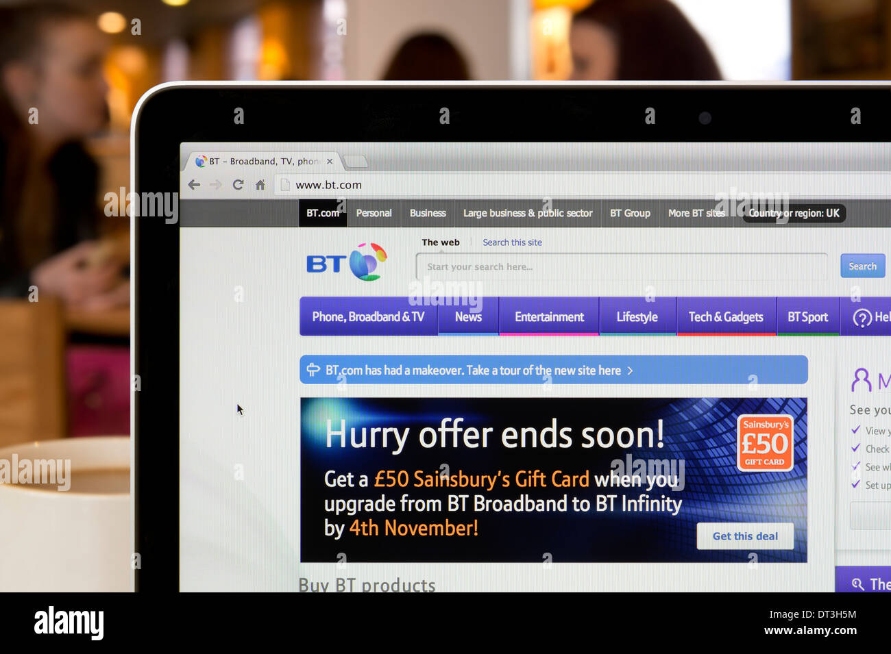 The BT website shot in a coffee shop environment (Editorial use only: print, TV, e-book and editorial website). Stock Photo