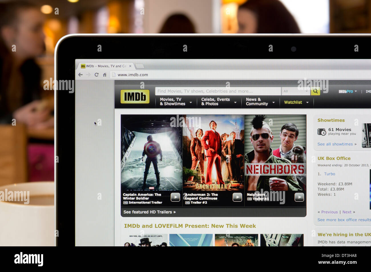 The IMDb website shot in a coffee shop environment (Editorial use only: print, TV, e-book and editorial website). Stock Photo