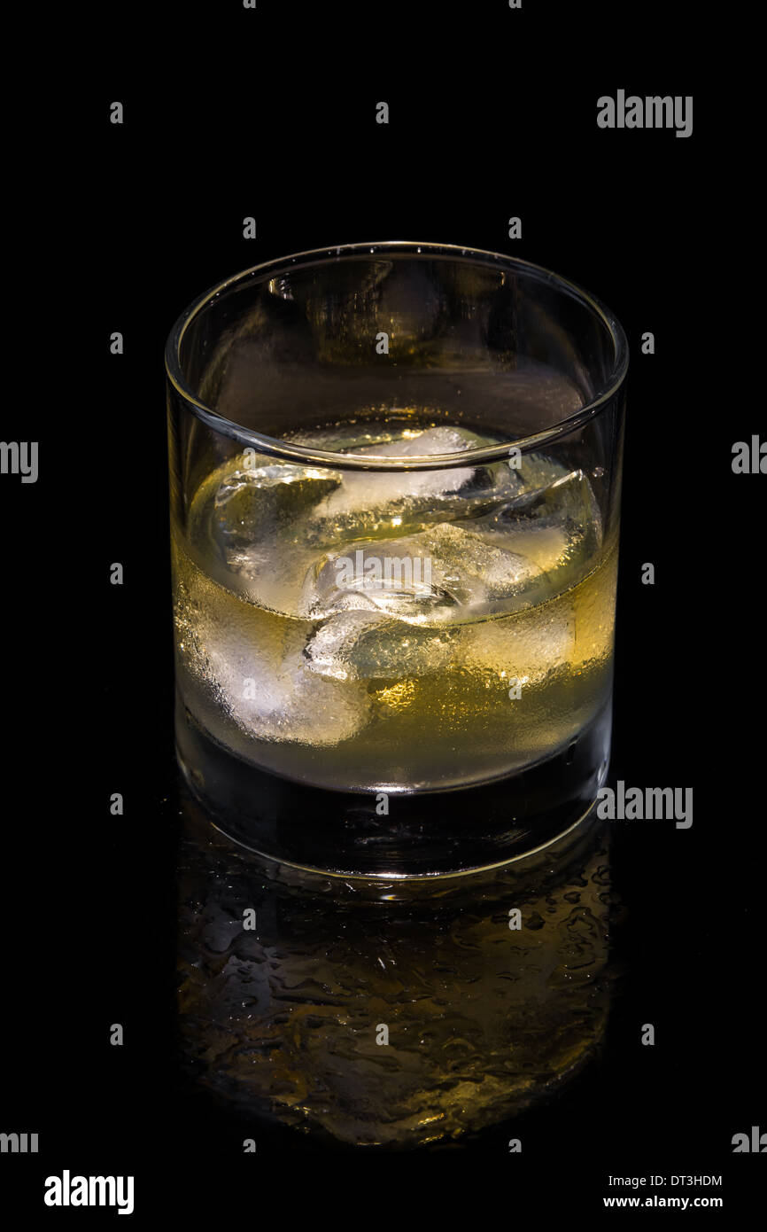 glass of whiskey on the rocks isolated on a black background Stock ...