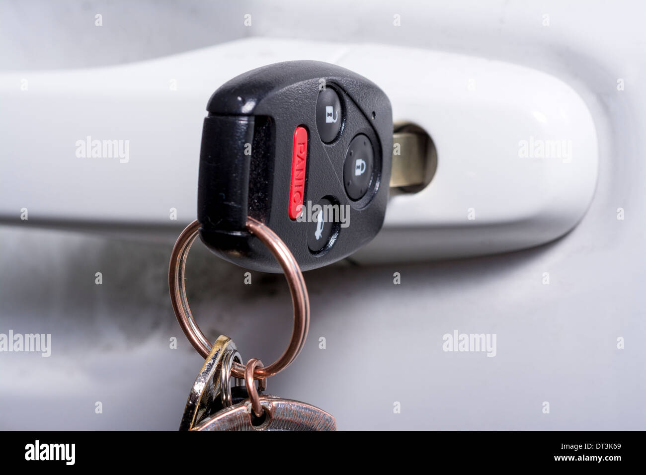 Key Fob inserted into a car door handle Stock Photo