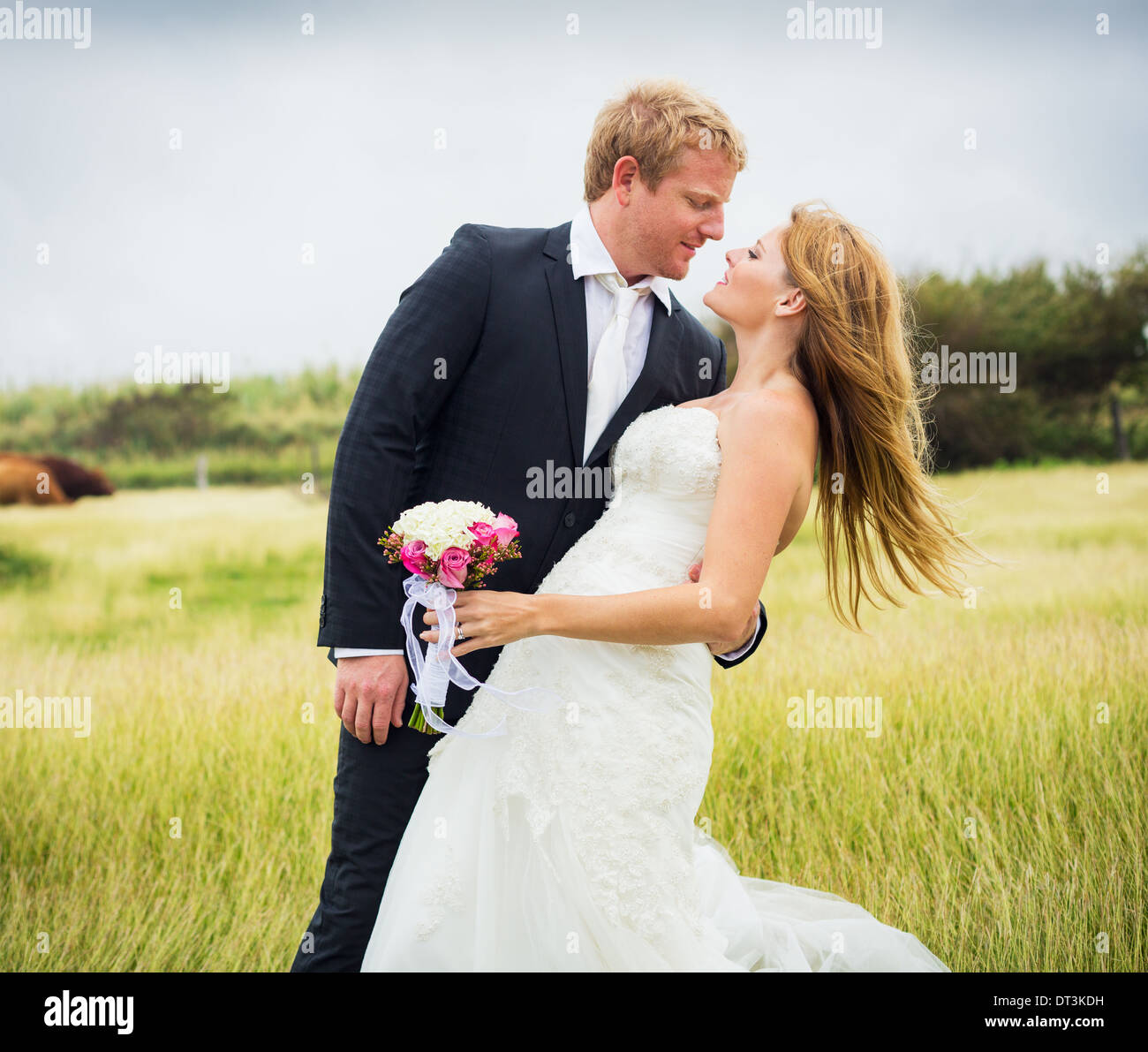 Wedding Couple, Happy romantic bride and groom kissing Stock Photo - Alamy