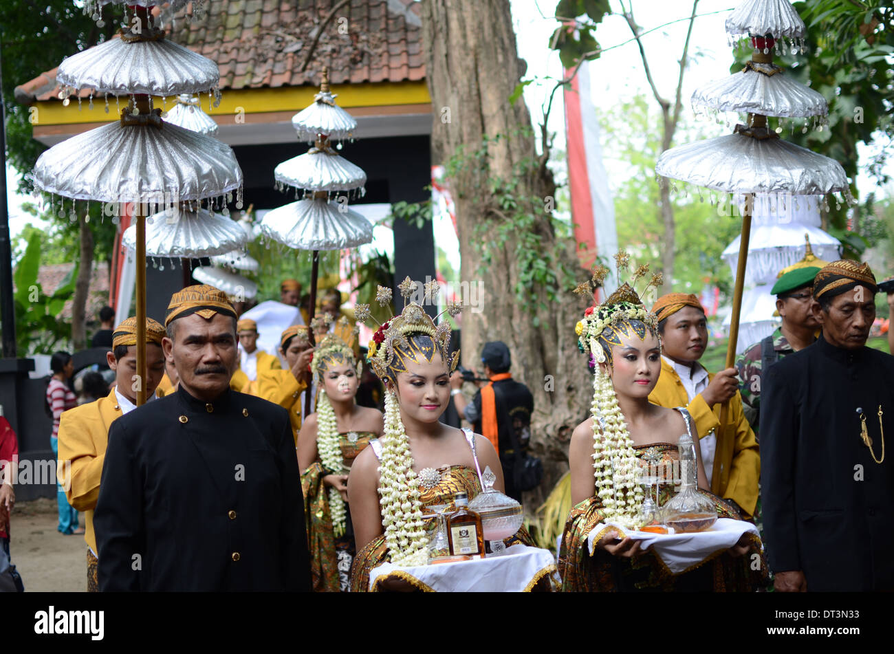 Liquor offerings to ancestors paraded around Doko village. Indonesia is the world's most populous Islamic country where about 85 Stock Photo