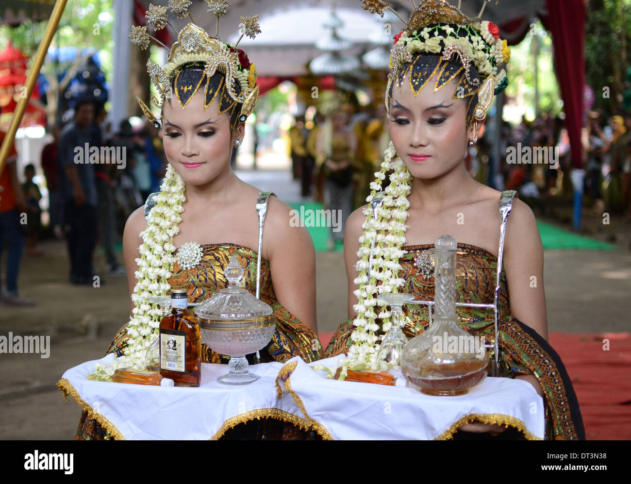 Liquor offerings to ancestors paraded around Doko village. Stock Photo