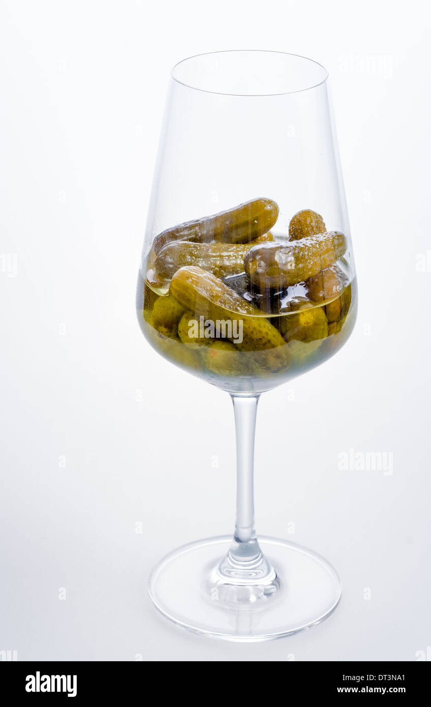 Green pickles in a beautiful wine glass Stock Photo