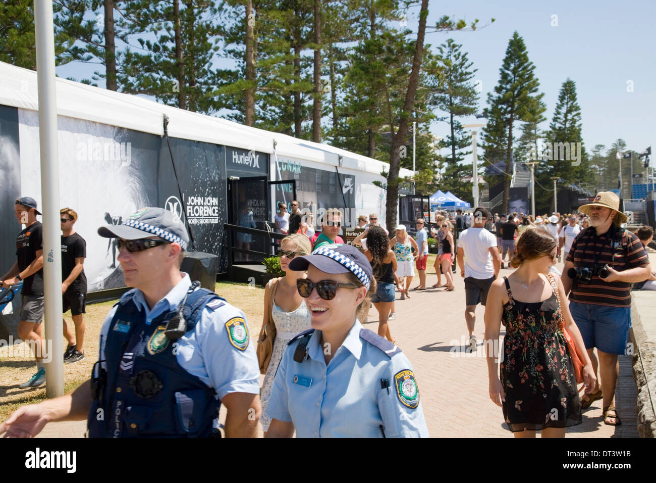 Two new south wales police officers male and female on patrol during  Hurley Australian Open of Surfing at Sydney's Iconic Manly Beach,Australia Stock Photo