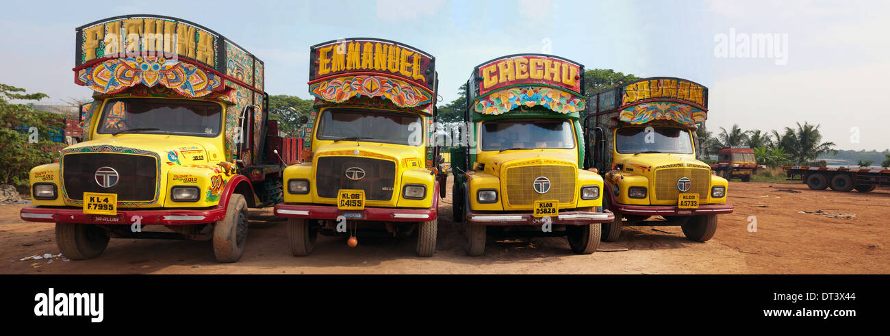 A row of owner-driven lorries, painted in the traditional Cochin style. Stock Photo