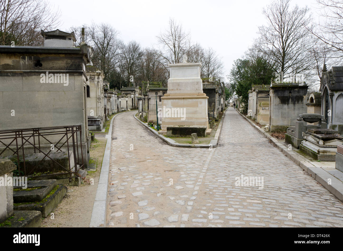 Streets of Pere Lachaise, flanked by mausoleums , the largest Cemetery in Paris, France. Stock Photo