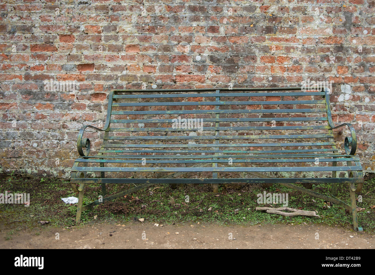Green Metal Seat By A Garden Wall Stock Photo 66472541 Alamy