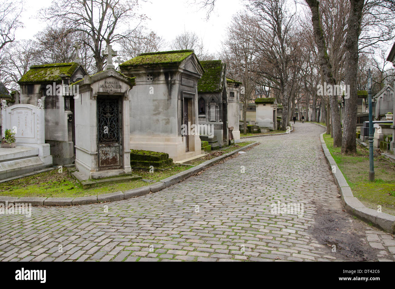 Street of Pere Lachaise, flanked by mausoleums , the largest Cemetery in Paris, France. Stock Photo