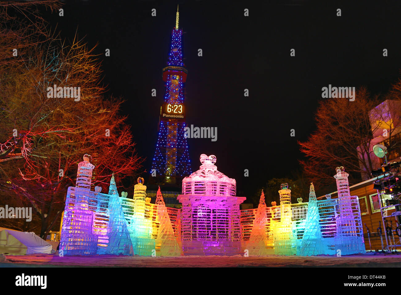 Sapporo, Japan. 8th February 2014. Ice sculpture called The Palace of Heart, which features ice statues of fairies that are making and carrying hearts, symbolising feelings - Ice Sculptures went on display and were illuminated ahead of the opening of the 65th Sapporo Snow Festival 2014 in Sapporo, Japan. The festival opens on the 5th February and runs until the 11th and is attended by over two million people! Also in shot is the Sapporo Tower. Credit:  Paul Brown/Alamy Live News Stock Photo
