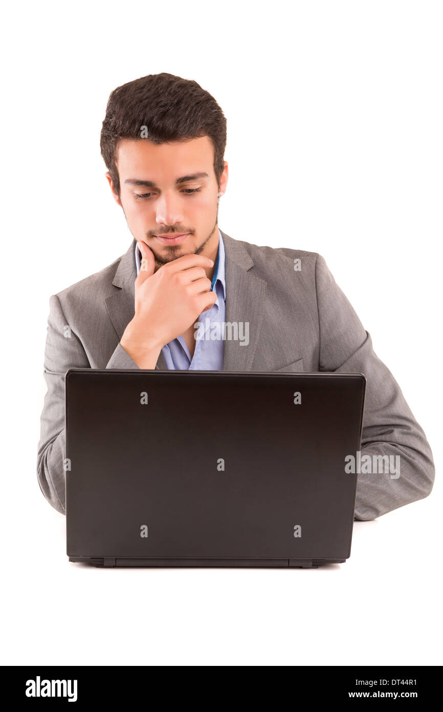 Young handsome man working with laptop computer Stock Photo