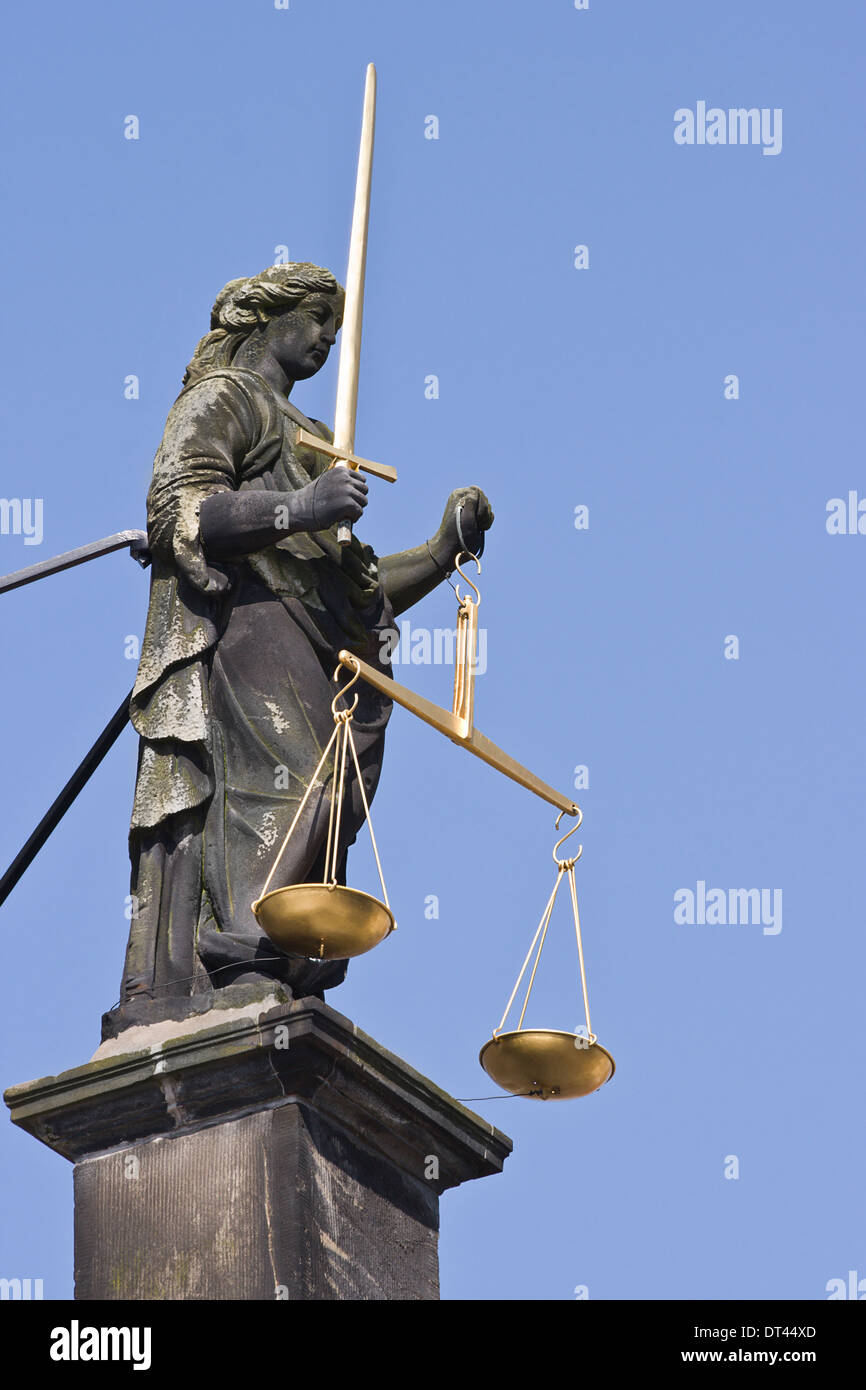 Statue of Lady Justice with sword and balance scales, not blindfolded Stock Photo