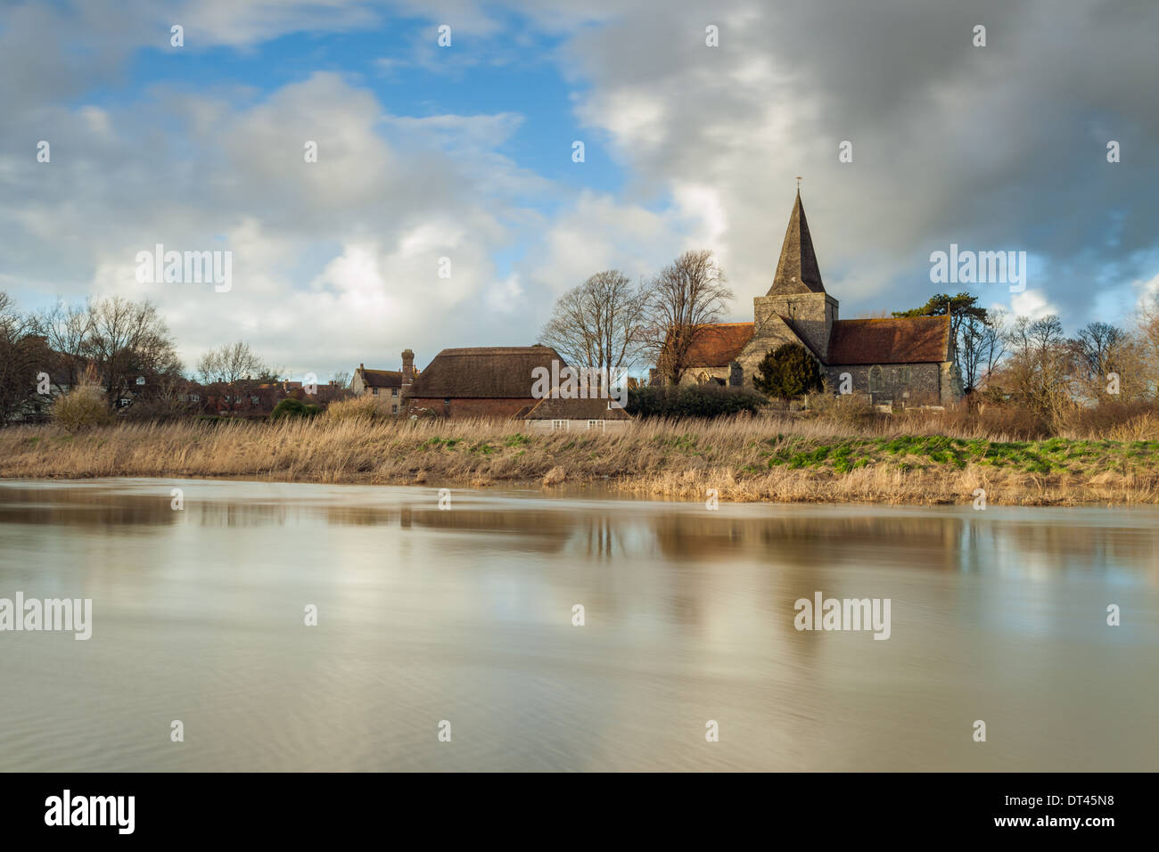 St Andrew's Church ('Cathedral of the Downs') in flooded Alfriston, a picturesque medieval village in East Sussex, England. Stock Photo
