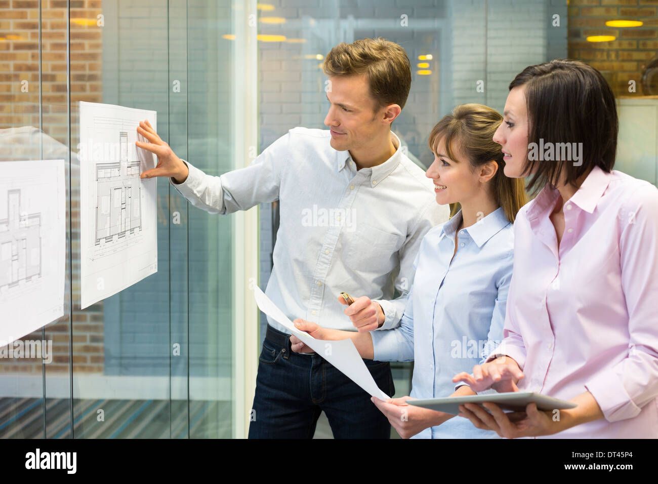 Business man woman plans meeting colleagues Stock Photo