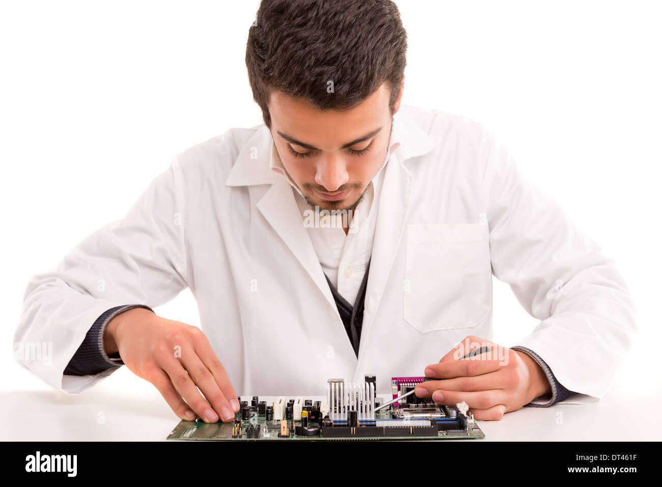A computer engineer or technician, working on a computer motherboard ...