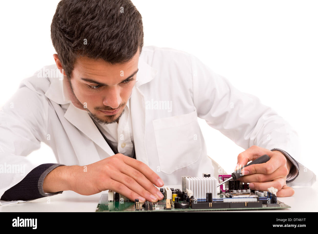 A computer engineer or technician, working on a computer motherboard ...