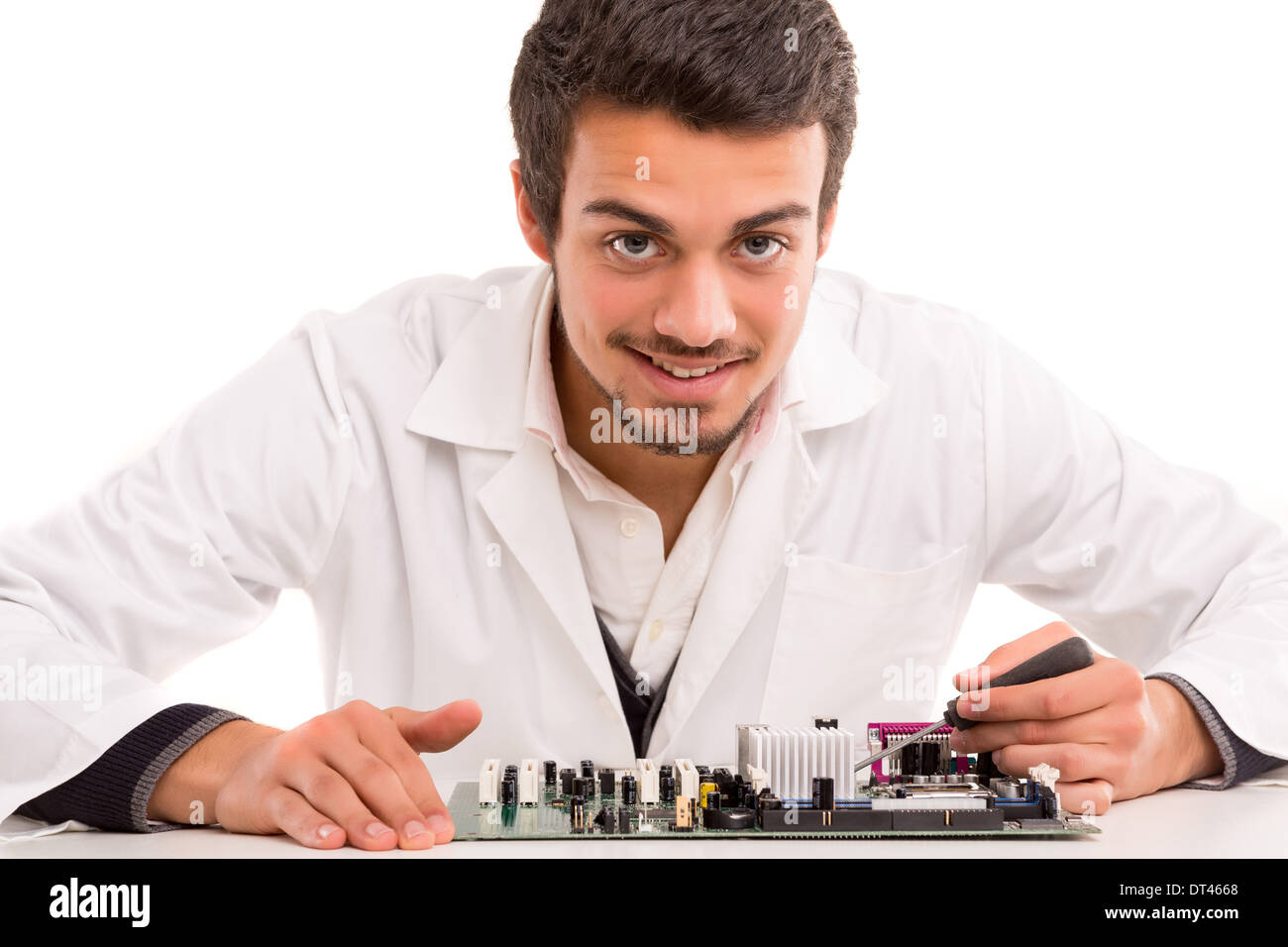 A computer engineer or technician, working on a computer motherboard