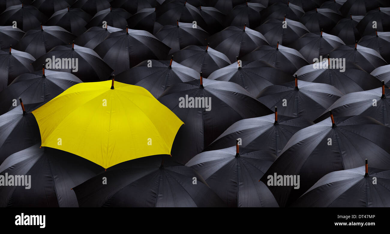 many blacks umbrellas and one yellow umbrella Stock Photo Alamy