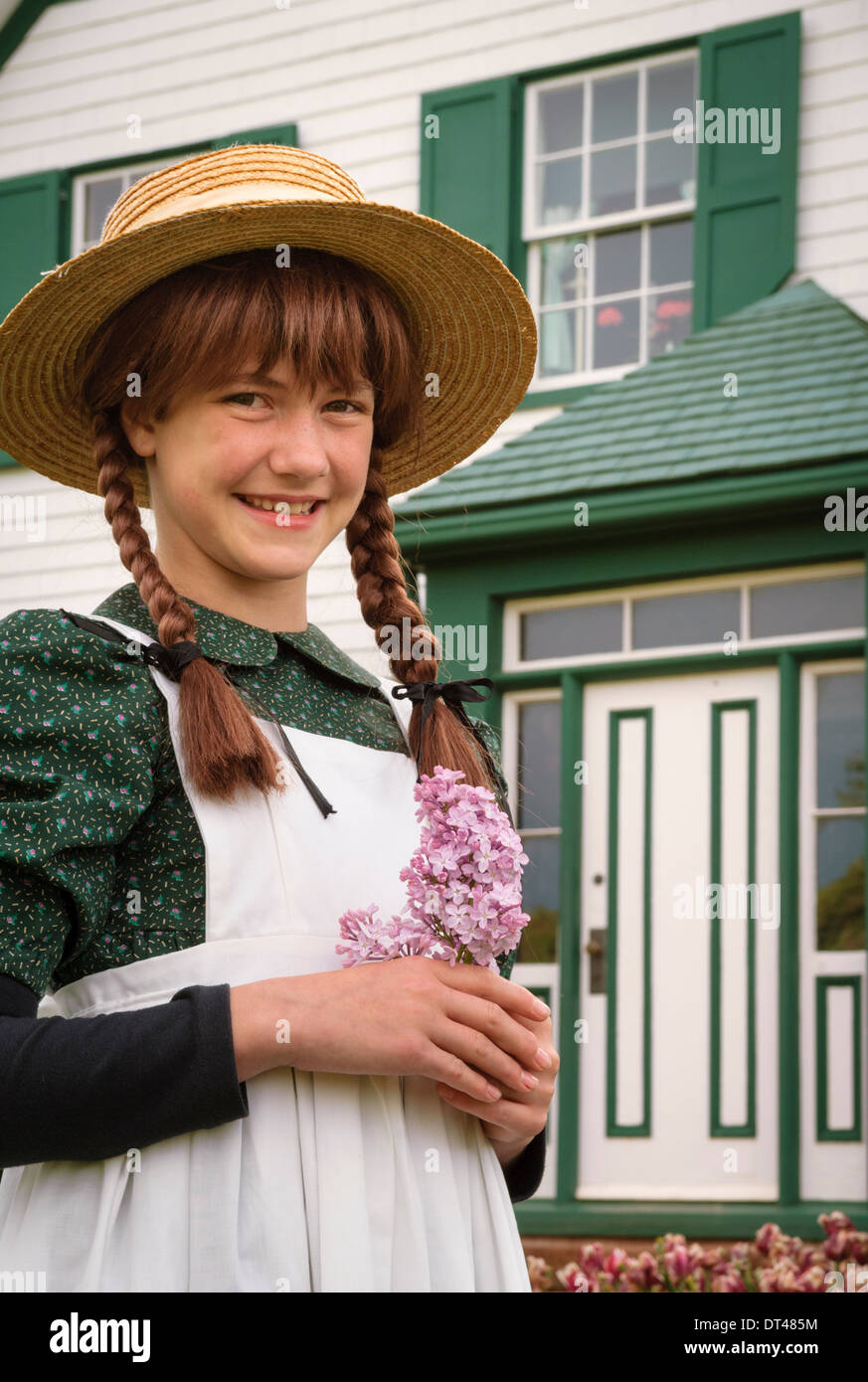 Andrea Hickey posing as Anne of Green Gables at the Green Gables house; Prince Edward Island, Canada. Stock Photo