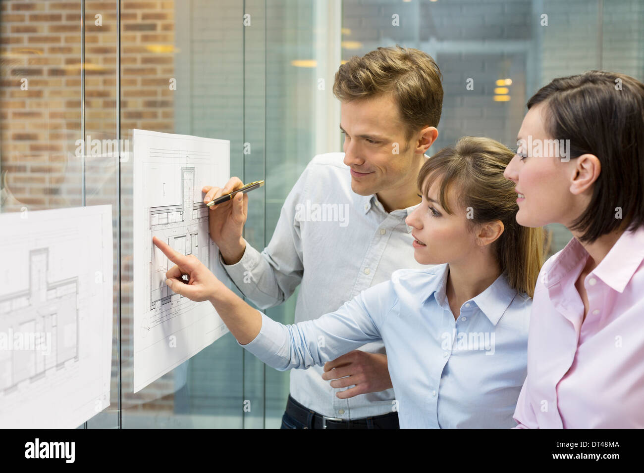 Business man woman plans meeting colleagues Stock Photo