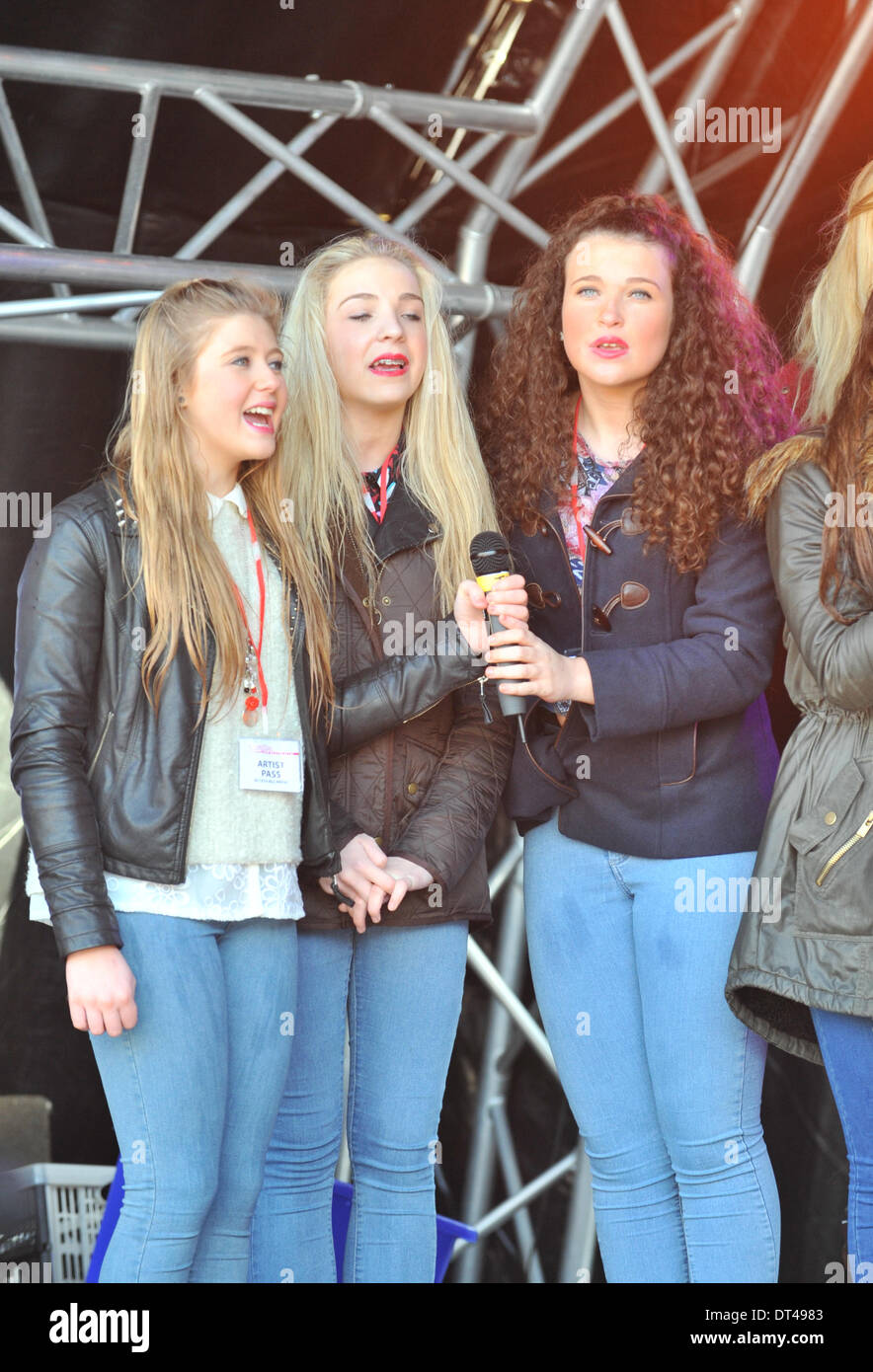 Trafalgar Square, London, UK. 8th February 2014.  Members of the group, sing at the release of the charity single 'Miss You Machine'. Aiming to raise money on behalf of the Fusiliers Aid Society in memory of Lee Rigby and others like him. Credit:  Matthew Chattle/Alamy Live News Stock Photo