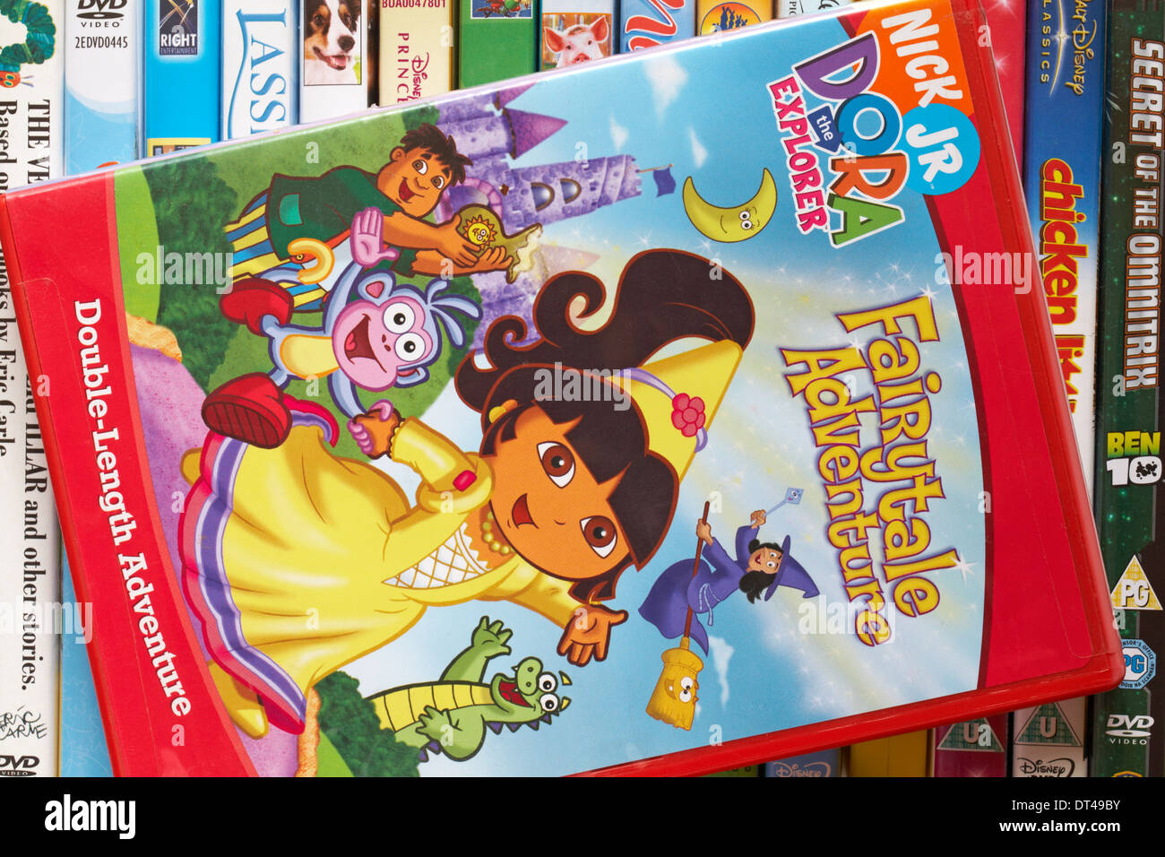 pile of DVDs with Dora the Explorer Fairytale Adventure DVD on top Stock Photo