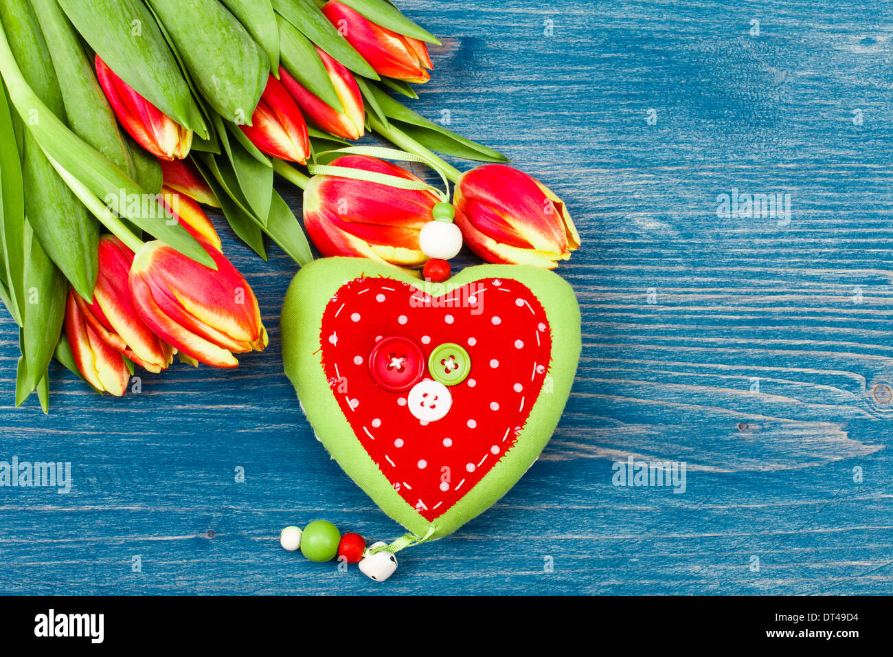 Tulip bouquet on a blue background, heart lining Stock Photo