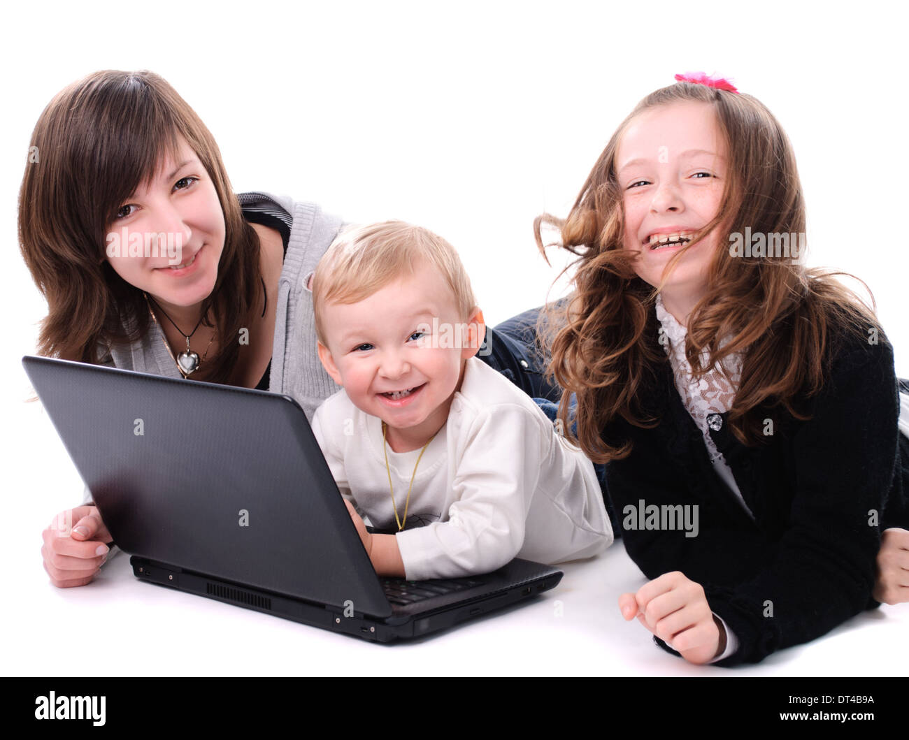 Three children play with laptop, isolated on white Stock Photo - Alamy