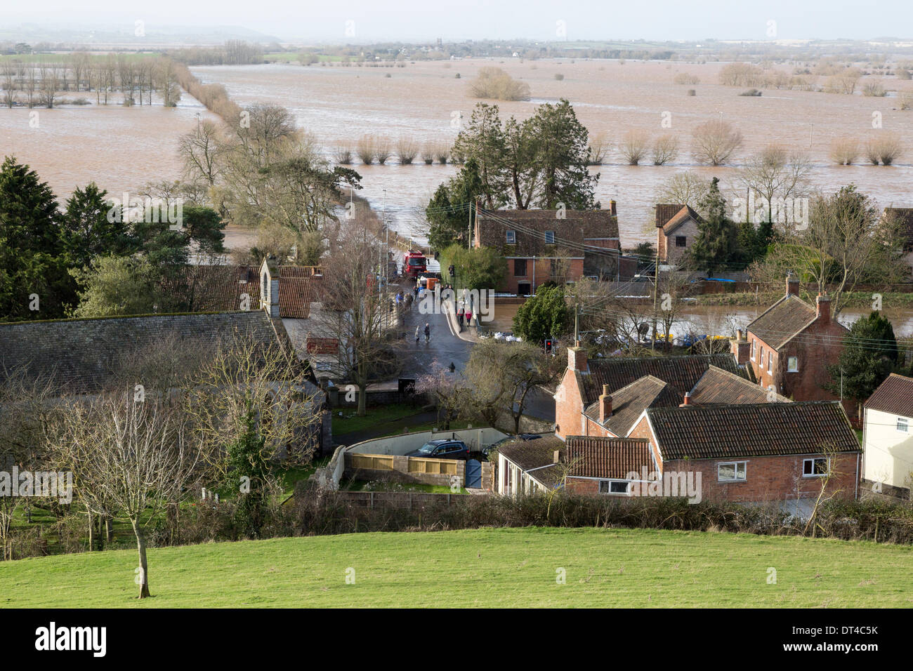 Borrowbridge, Somerset, UK. 8th February 2014. The village of Burrowbridge in Somerset on 8th February 2014 surrounded by floodwater as viewed from the top of Burrow Mump. Due to exceptionally high rainfall, the River Parrett has been unable to cope with the volume of water and has flooded nearby farmland and the main road the A361 to Taunton has been closed for seven weeks. A severe flood alert which means life may be at risk remains in place and many occupants have been told to evacuate. Credit:  Nick Cable/Alamy Live News Stock Photo