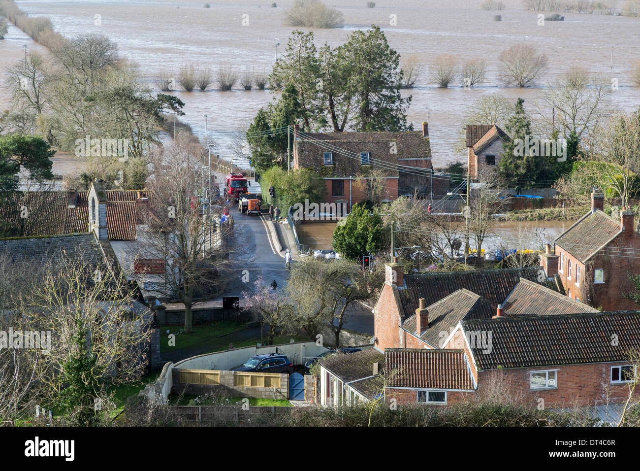 Borrowbridge, Somerset, UK. 8th February 2014. The village of Burrowbridge in Somerset on 8th February 2014 surrounded by floodwater as viewed from the top of Burrow Mump. Due to exceptionally high rainfall, the River Parrett has been unable to cope with the volume of water and has flooded nearby farmland and the main road the A361 to Taunton has been closed for seven weeks. A severe flood alert which means life may be at risk remains in place and many occupants have been told to evacuate. Credit:  Nick Cable/Alamy Live News Stock Photo