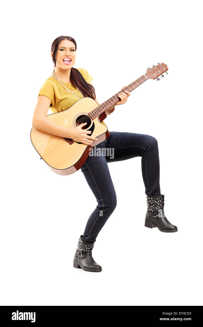 Stylish Young Man In Hat Posing With Acoustic Guitar While Sitting On Chair  On Black Stock Photo, Picture and Royalty Free Image. Image 117395498.