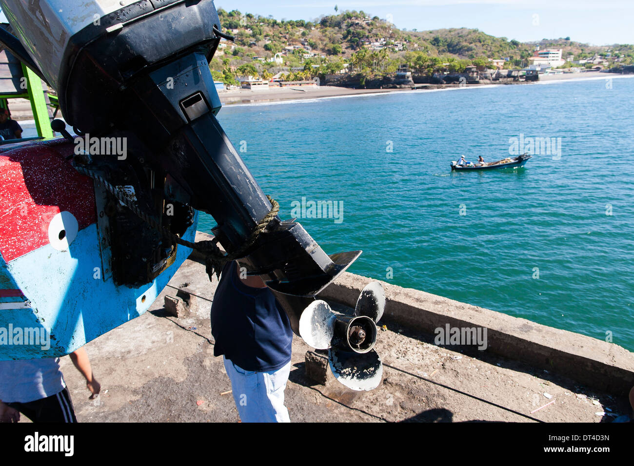 Fishing boats launched and recovered by crane from the fishing pier in