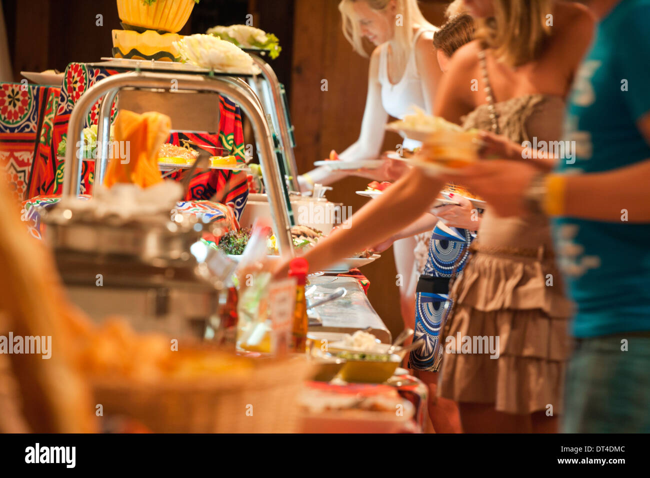 Abstract very shallow focus image of people at a buffet Stock Photo