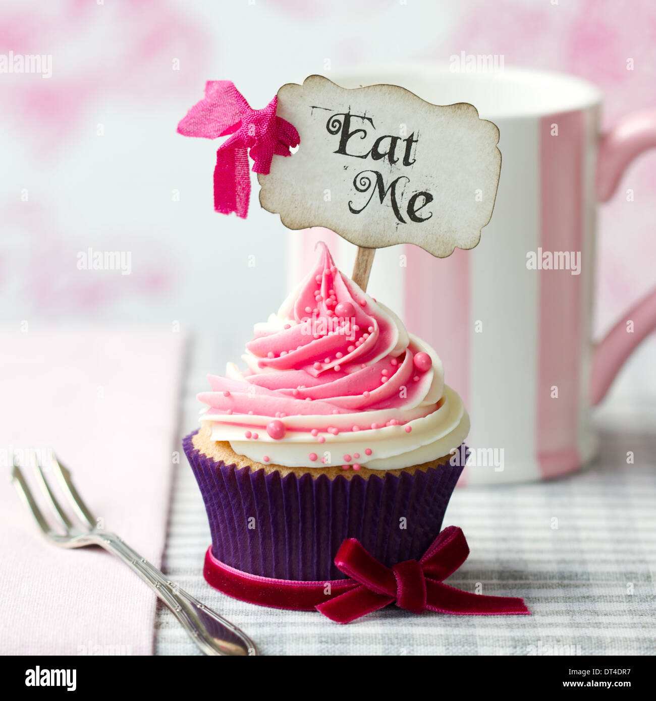 Cupcake with 'Eat Me' pick Stock Photo