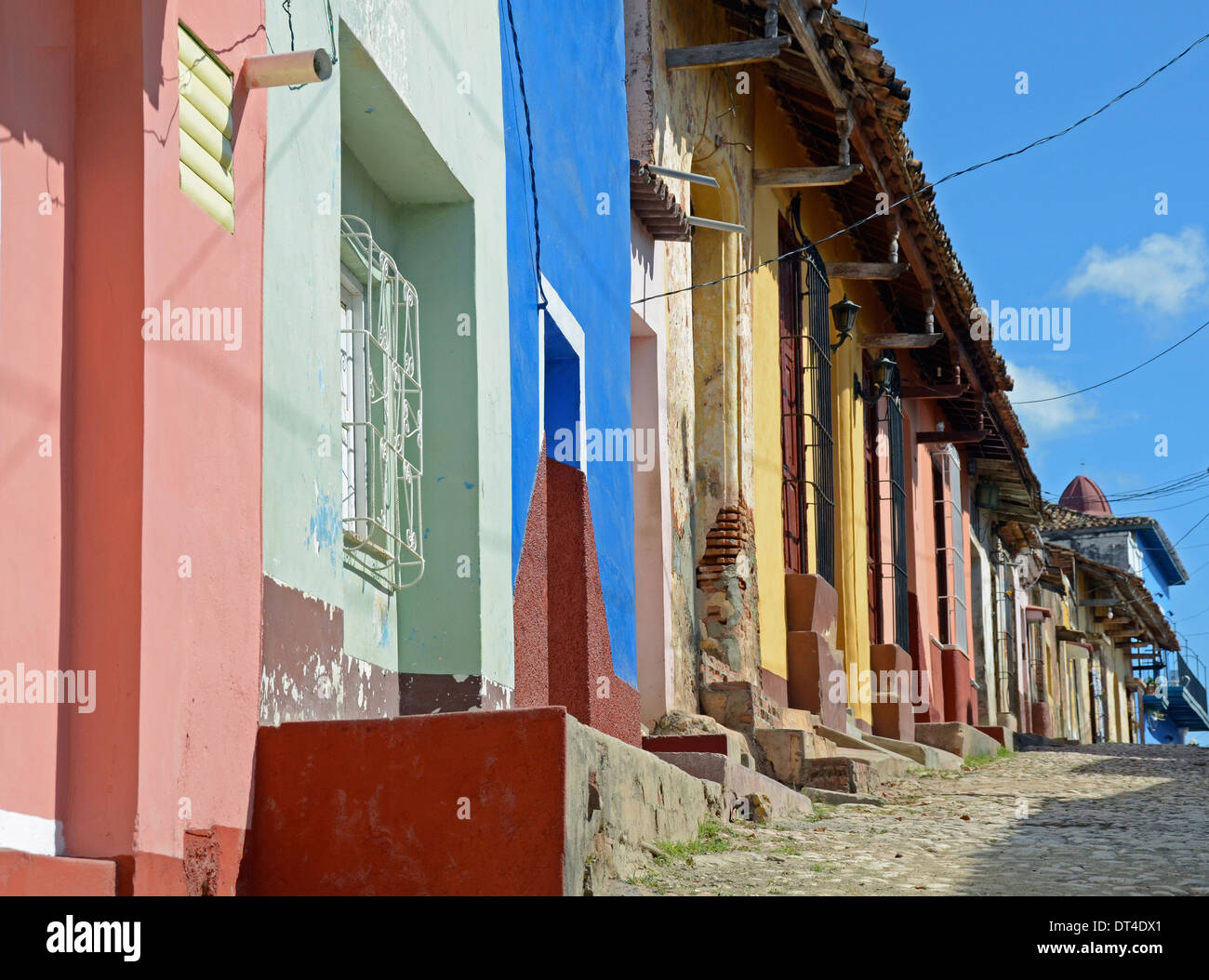 Street of brightly painted houses, Trinidad, Cuba Stock Photo