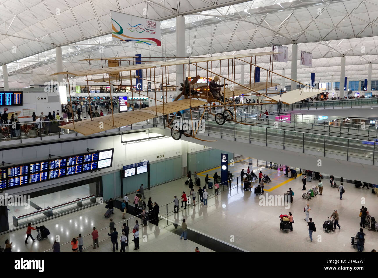 Replica airplane hanging in the passenger terminal of Hong Kong International Airport, China. Stock Photo