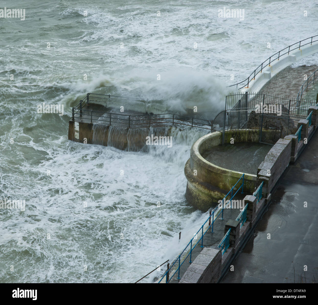 Plymouth, Devon, UK. 8th February 2014. Waves crash up the high walls of the lido, Plymouth, England during a passing storm. Credit:  Anna Stevenson/Alamy Live News Stock Photo