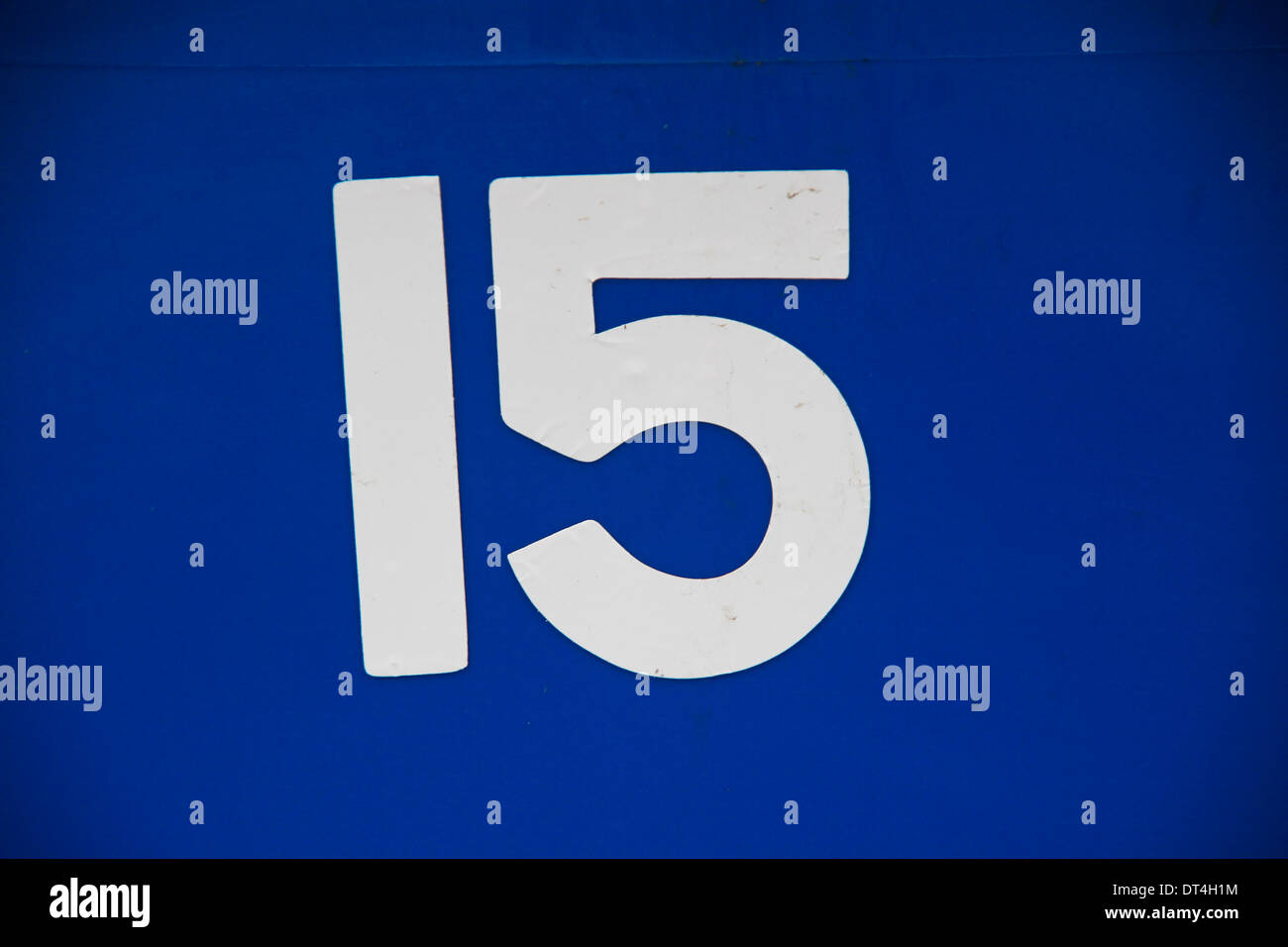 White number 15 on blue background Stock Photo