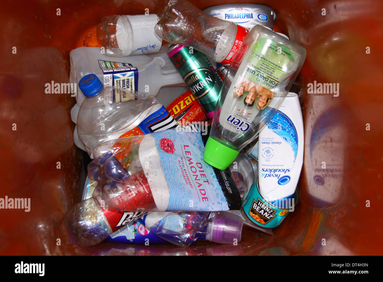 Bottles and tins in recycling bin Stock Photo