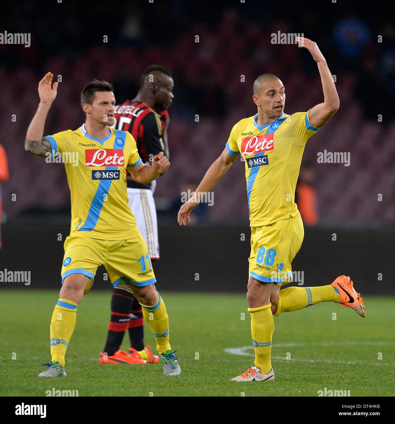 Naples, Italy. 8th Feb, 2014. Napoli's Gokhan Inler (R) celebrates scoring during the Italian Serie A soccer match against AC Milan at San Paolo stadium in Naples, Italy, Feb. 8, 2014. Napoli won 3:1. Credit:  Alberto Lingria/Xinhua/Alamy Live News Stock Photo