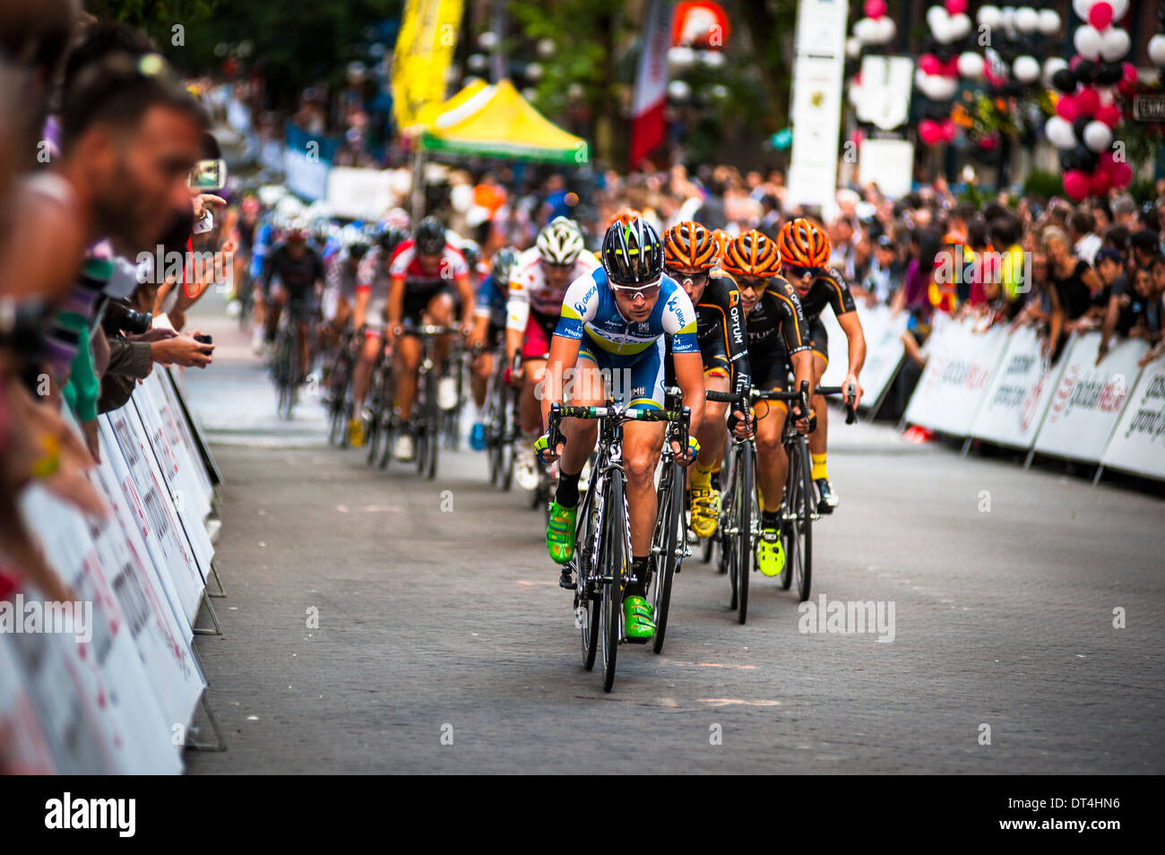 Vancouver, British Columbia, - July 10: Men and women compete in the 2013 Gastown Grand Prix cycling race, July 10, 2013. Stock Photo