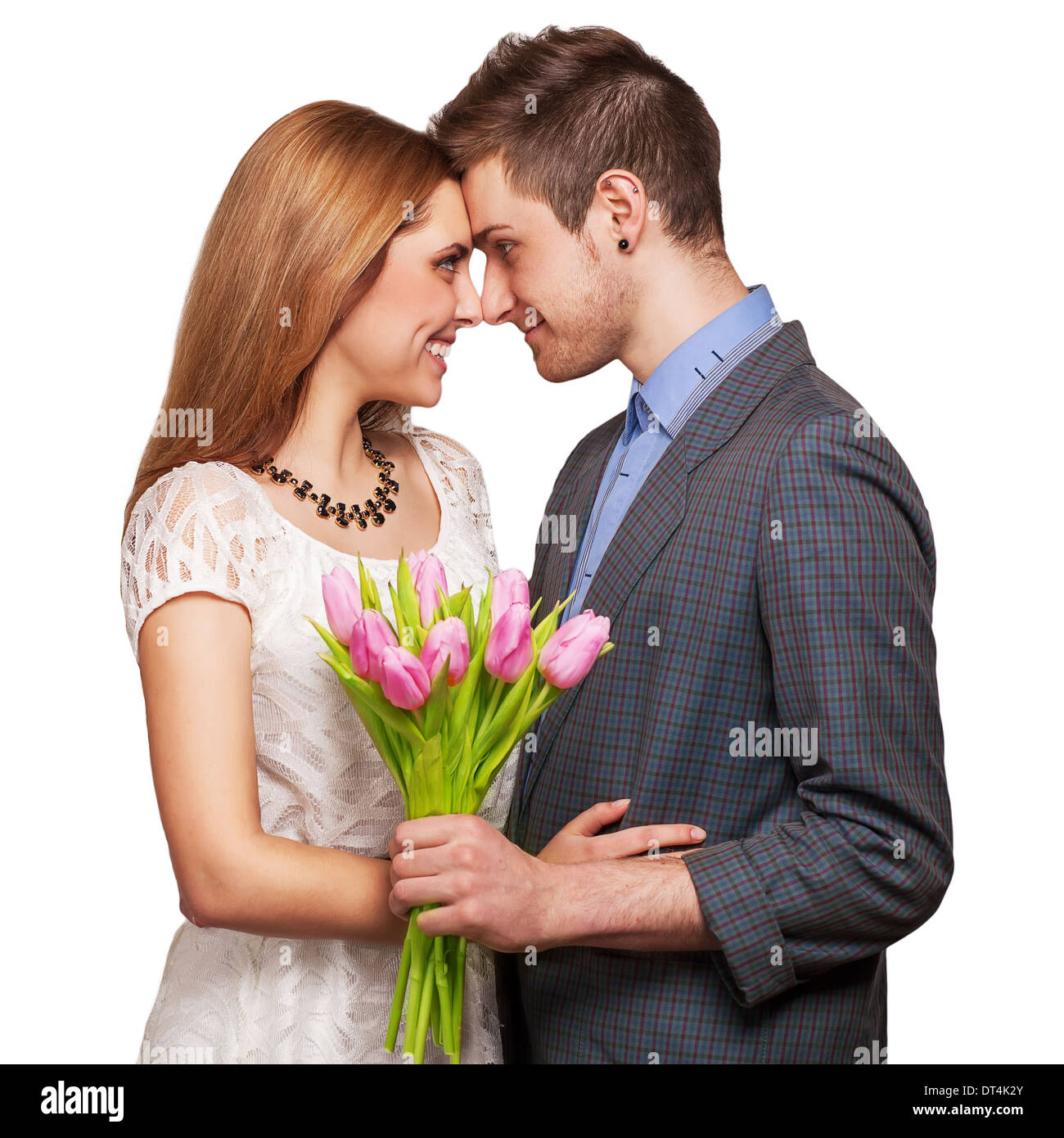 couple in love with a bouquet of tulips are close to each other  Stock Photo