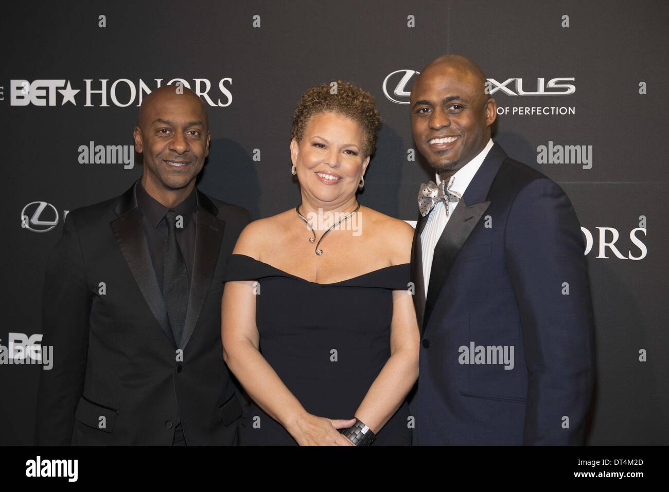 Washington, DC, USA. 8th Feb, 2014. STEPHEN G HILL, president of music and DEBRA LEE, CEO OF BET NETWORKS with BET Honors host, WAYNE BRADY, at the BET Honors which was held at the historic Warner Theater in Washington DC Credit:  Ricky Fitchett/ZUMAPRESS.com/Alamy Live News Stock Photo