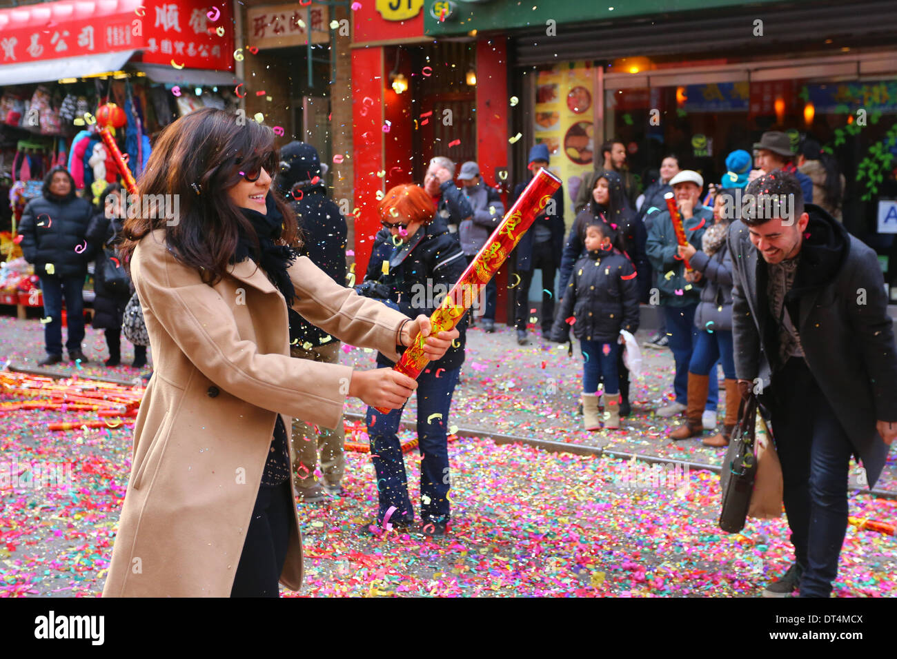 People popping noise makers celebrating the Chinese New Year in