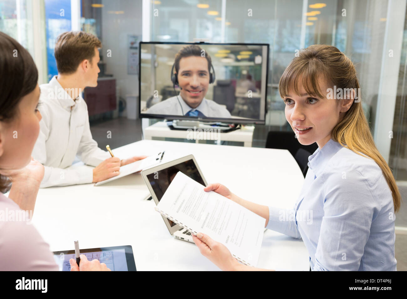 Businesswoman businessman desk chat colleagues Stock Photo