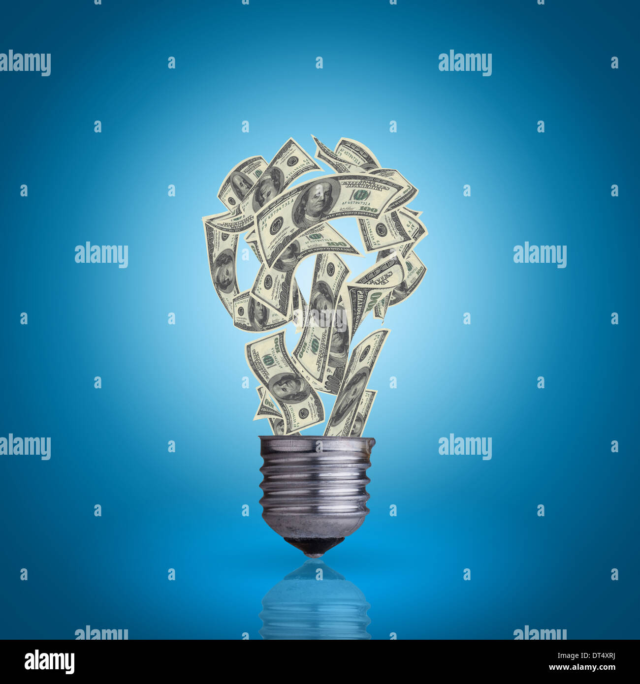 light bulb with money banknotes inside it on blue background Stock